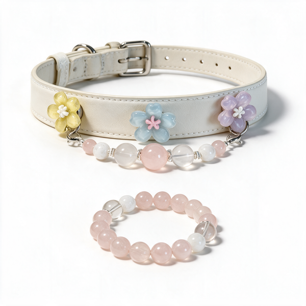 Blush Companion matching set: white floral dog collar with pink, white and clear beads beside its matching owner bracelet on white.