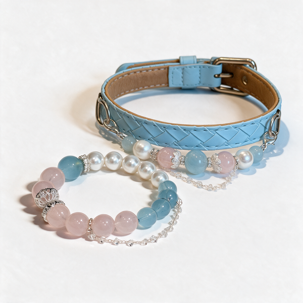 Coastal Blush matching set with a light-blue pet collar and a coordinating pink, blue and pearl-like bead bracelet on a white background.