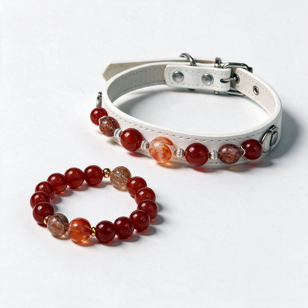 Ember Together matching set with one white pet collar and one red, brown and orange bead bracelet on a white background.