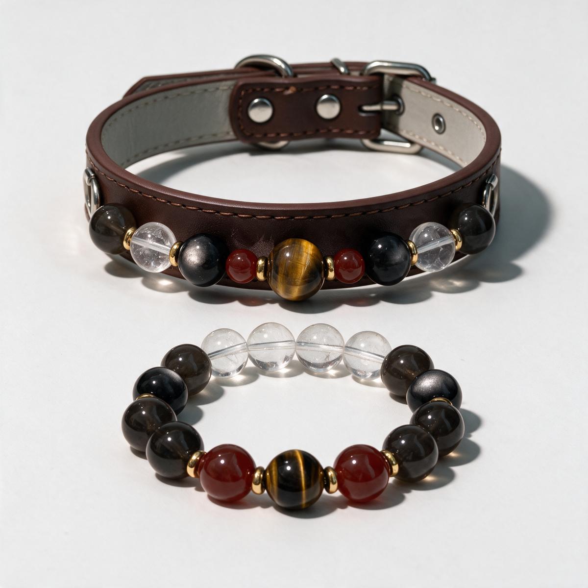 Brown collar and coordinating Bronze Promise owner bracelet arranged separately on a white background.