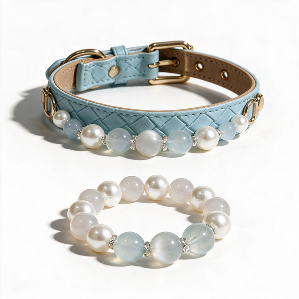 Moonlit Tide pale-blue woven crystal dog collar and matching pearl-tone owner bracelet on a white background.