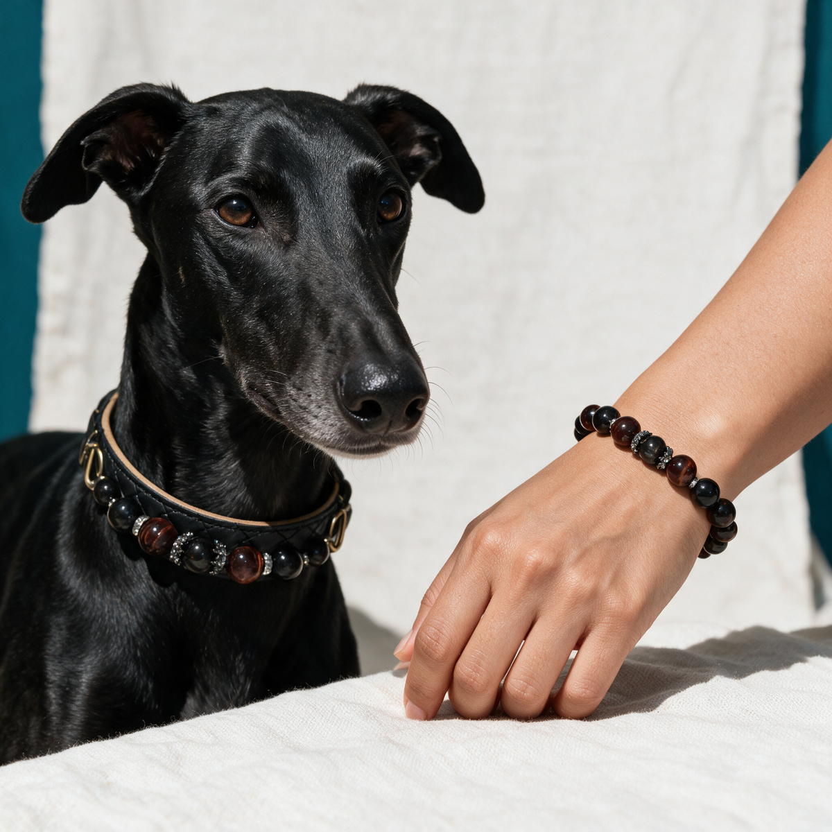 Close view of the Velvet Dusk black quilted dog collar and coordinating bracelet, showing black, smoky-gray and red-brown beads with metal accents.