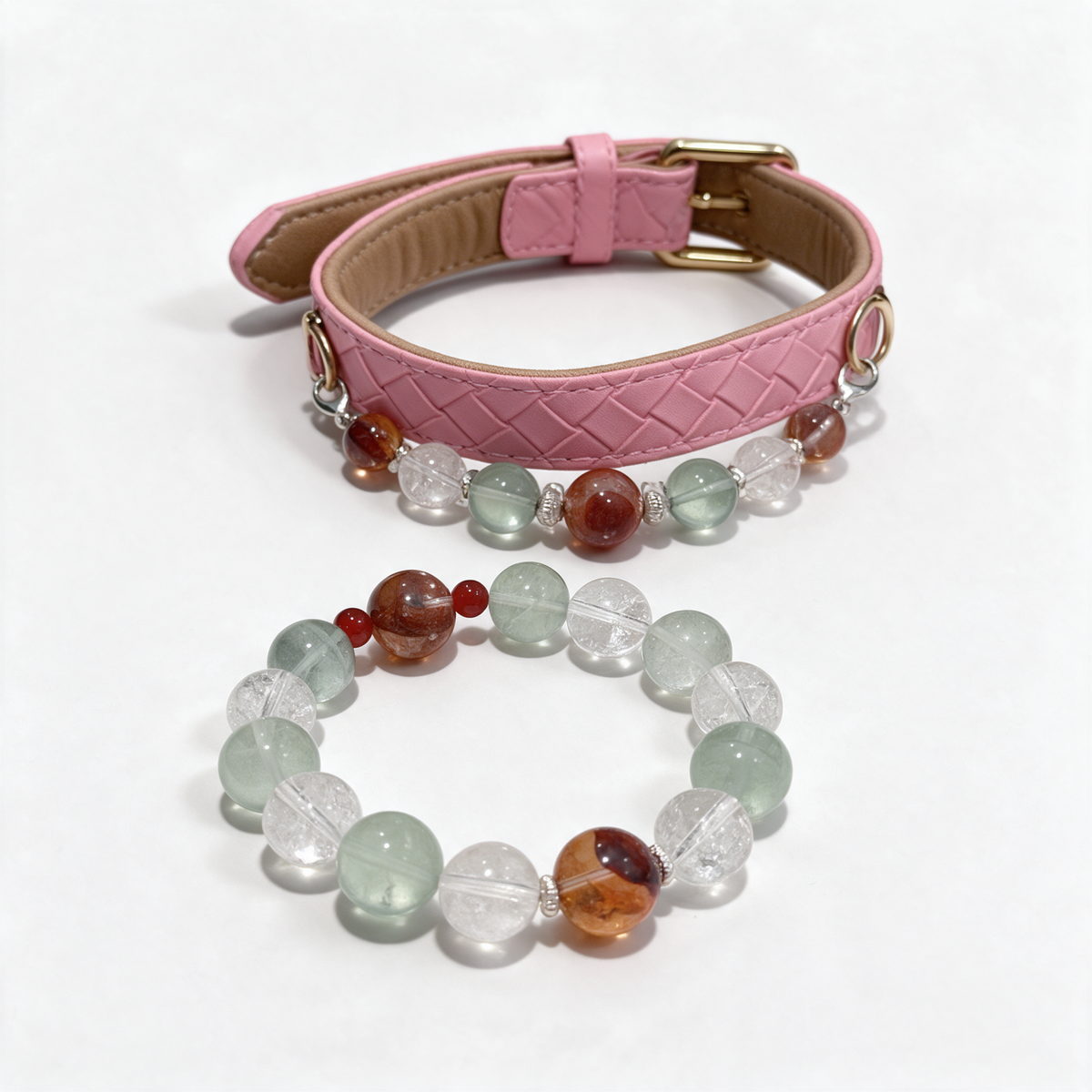 Garden Ember matching set: pink quilted dog collar with green, clear and reddish-brown beads, beside the matching owner bracelet on white.