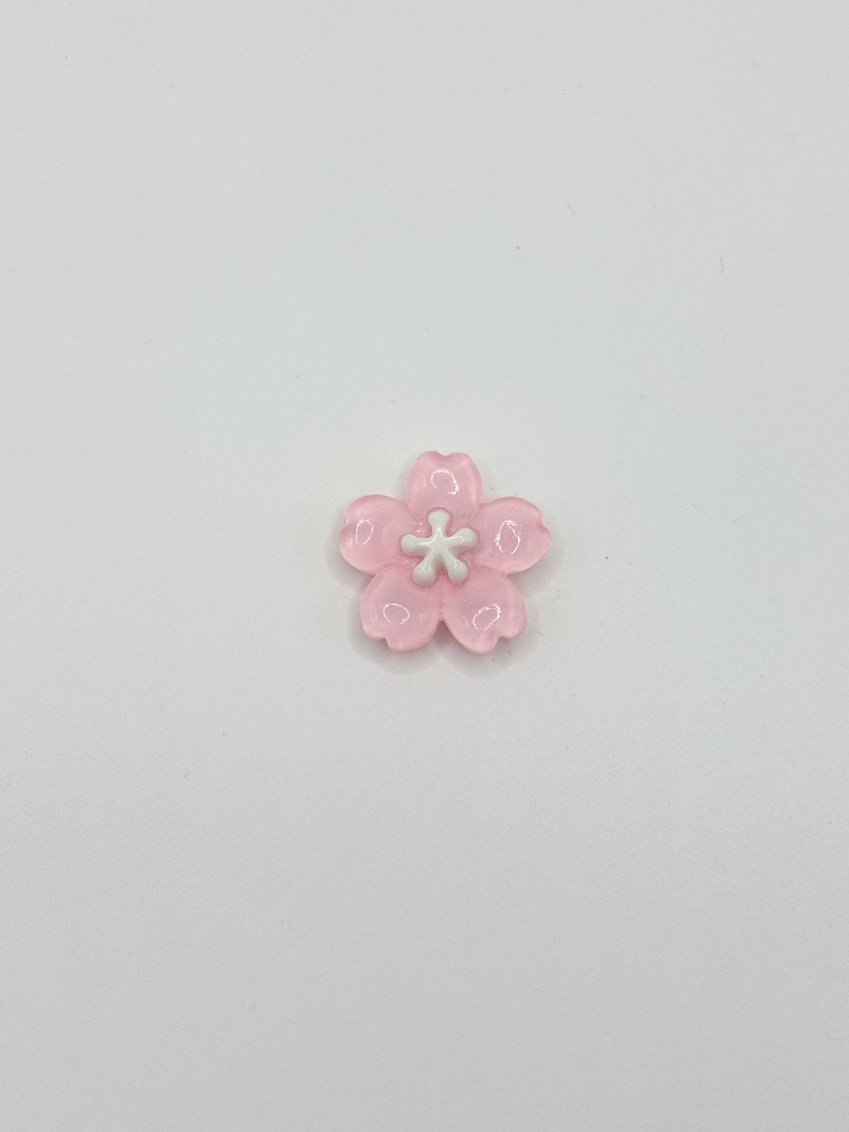 Pink flower removable decorative charm, sold individually.