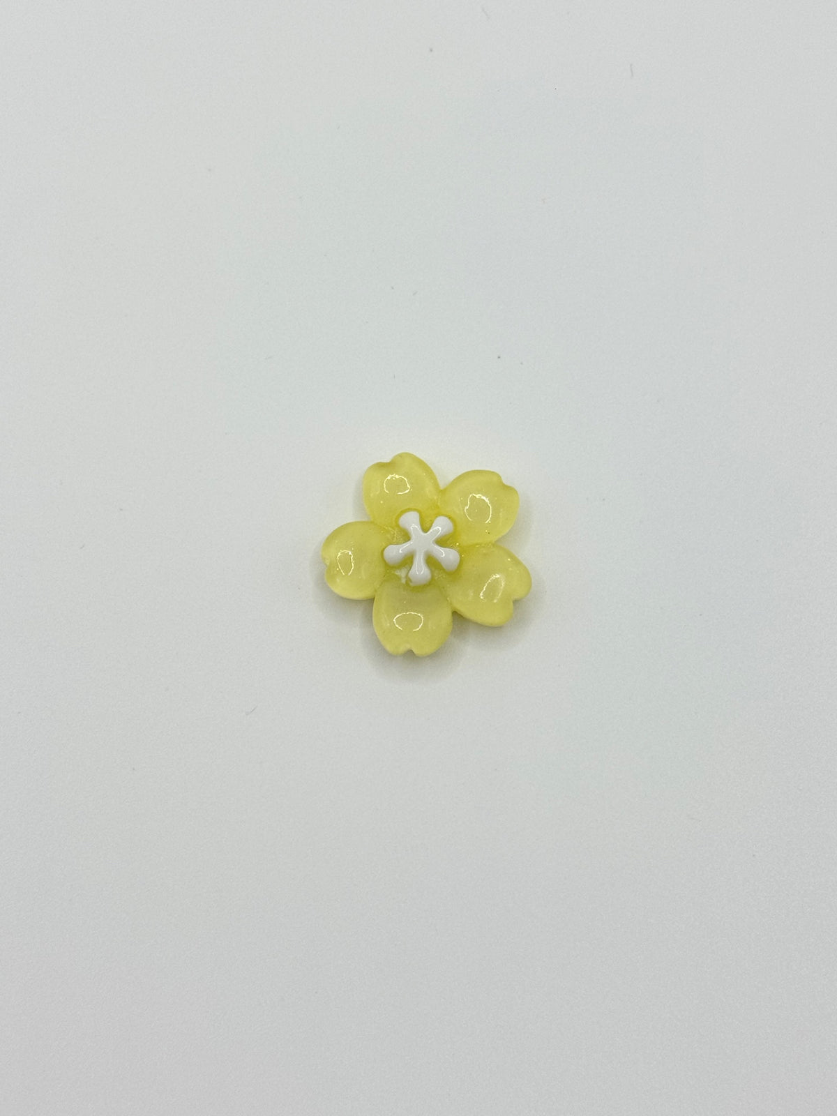 Yellow flower removable decorative charm, sold individually.