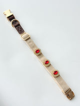 S/M cream buckle collar styled with three charms. Every size includes five selectable charms; extra charms and leash sold separately.