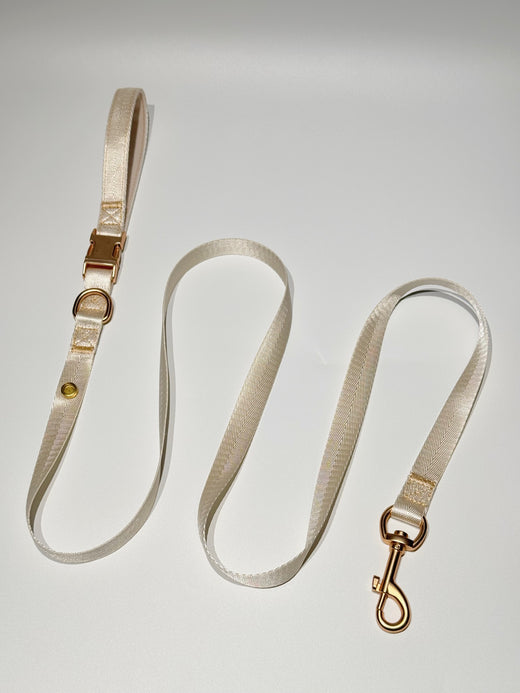 Cream coordinating leash; decorative charms sold separately.